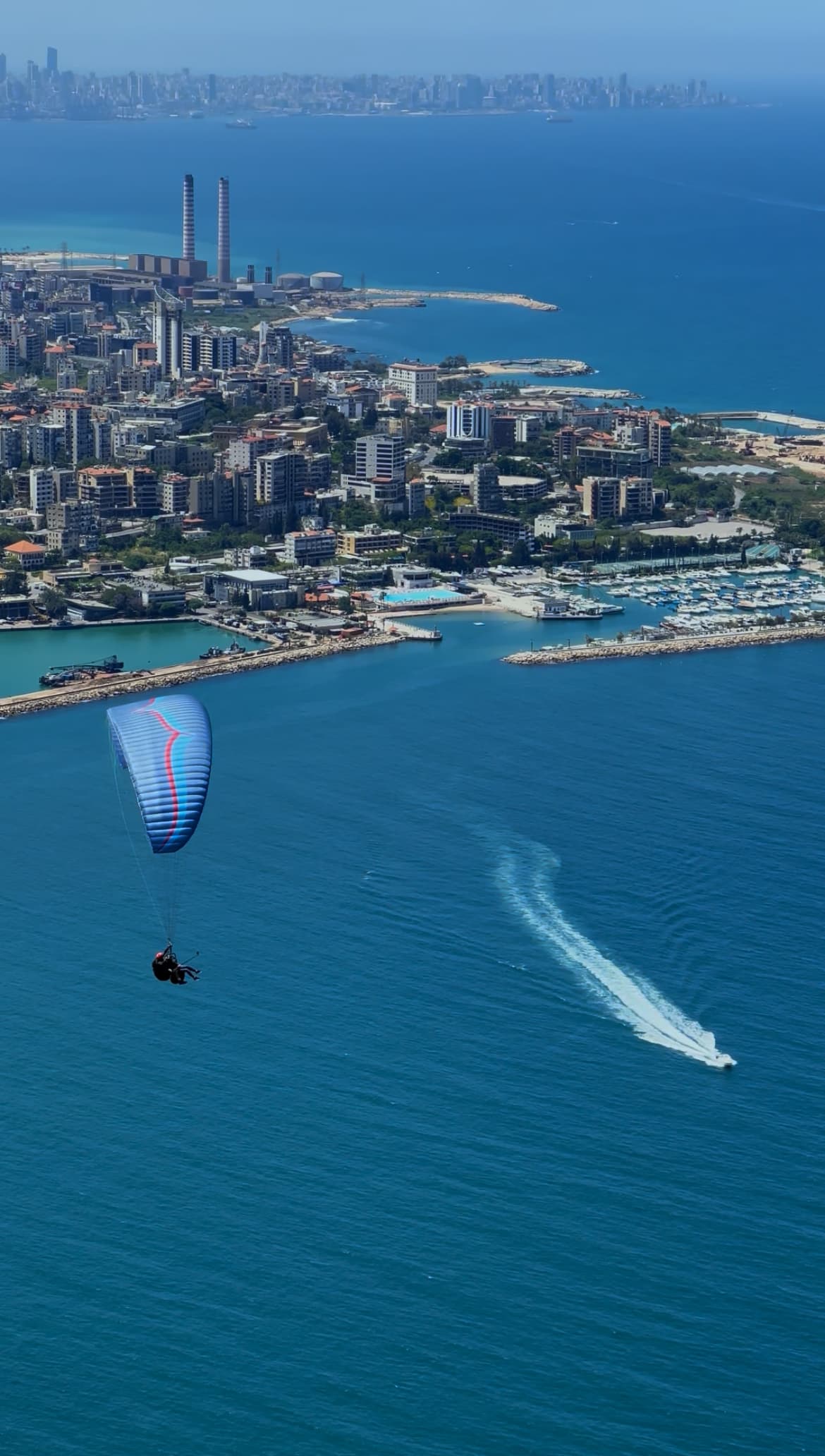 Tandem paraglider over the Jounieh Mediterranean coastline with LebPar